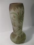 22.	French “Galle”, Glass Vase, circa 1915.      Appraisal Est. $3,400
Cameo blown and carved glass vase, with long oval form with bulbous vase shape. Carved scene with flowers and foliage. Signed “Galle”. 11-3/4” high.
