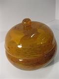 24.	Covered Glass Bowl, circa 1920.    Appraisal Est. $475
Bowl with domed cover, and button knob in amber glass, with mottled coloring. Not marked, 5” high
