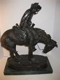 61.	Remington Bronze “Northern” Sculpture, circa 1950’s.               Pre-sale Est. $2,800
This cast bronze Remington sculpture was the first he did in the lost wax method and the 5th in his series of bronzes. Featuring the fierce winds blowing from the backside of the half frozen cowboy, shows the determination of the early man overcoming the West.  Remington never thought this would be a very popular study, and he only made 3 original casts, but has become one his most sought after works. It measures 19-3/4” high, x 18-1/8” long, and 6-7/8” wide, on marble mount.

