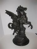 68.	Picault Bronze “Pegasus”, circa 1960.     Pre-sale Est. $3,100
This wonderful sculpture by the renown French artist, Emile-Louis Picault (1839-1915) features the famous “Pegasus” Cast signature on the bottom, along with Salon Des Beaux Arts 1888 Collection Francaise. 19-5/8” high, 14-1/2” long, 8-1/8” deep. 

