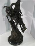 60.	Remington Bronze “Mountain Man” Sculpture, circa 1960.               Pre-sale Est. $3,800
This Remington cast bronze is considered by most, including Remington himself, one of his most revered and popular. It features the “Mountain Man” and depicts the typical Iroquois trapper descending the steep mountain hillsides. The detailing of this piece is one of his finest works, and the placement of the trappers horn, allows us to know this was one of the early castings. 25-3/4” tall, 18-1/4” long, and 9-1/4” deep, on a marble mount.
