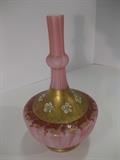 4.	English Glass Vase, circa. 1890          Appraised Est.  $450
Satin glass with foot rim. The narrow neck with a medial ring, sloping shoulder & globular body. Magenta striations on the white vessel. Band of six applied ceramic flowers on the gold enamel ground of slightly raised foliage motif. The shoulder edge has a repeating red & gold enamel scroll and vine motif. Measures about 8” high.
