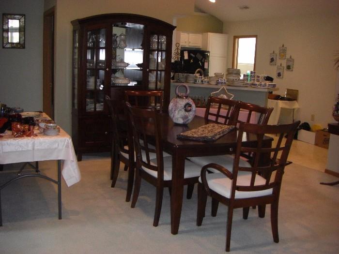 Dining Table with 2 Drawers, 6 Chairs, Leaf & Pads, matching lighted Hutch