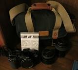 Minolta 35mm Camera with case and books and accessories.