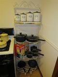 Very nice clean Bakers rack, lots of Pots and Pans, new in the box pyrex set and canister set.