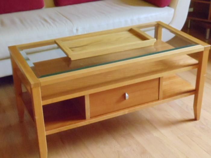 beautiful contemporary coffee table with storage drawers on each side.