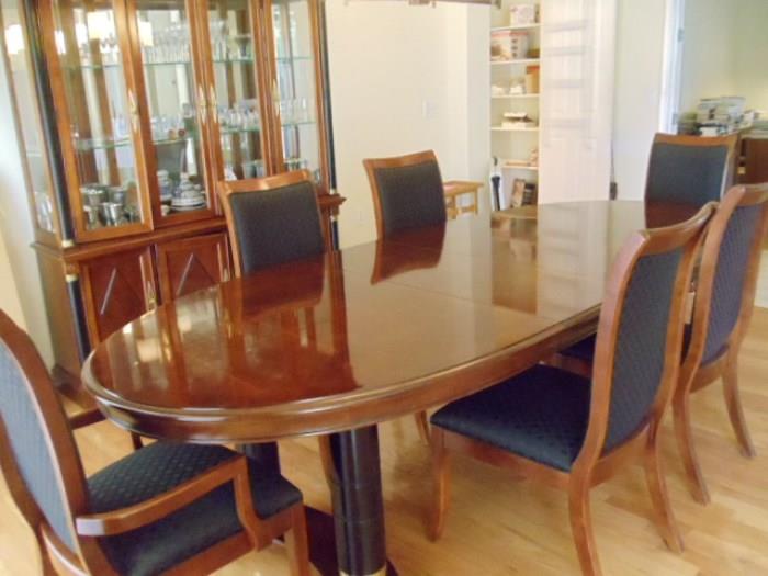 Manufactured by Wood One Empire design.  Includes 2 arm chairs and 6 dining room chairs, 2 leaves