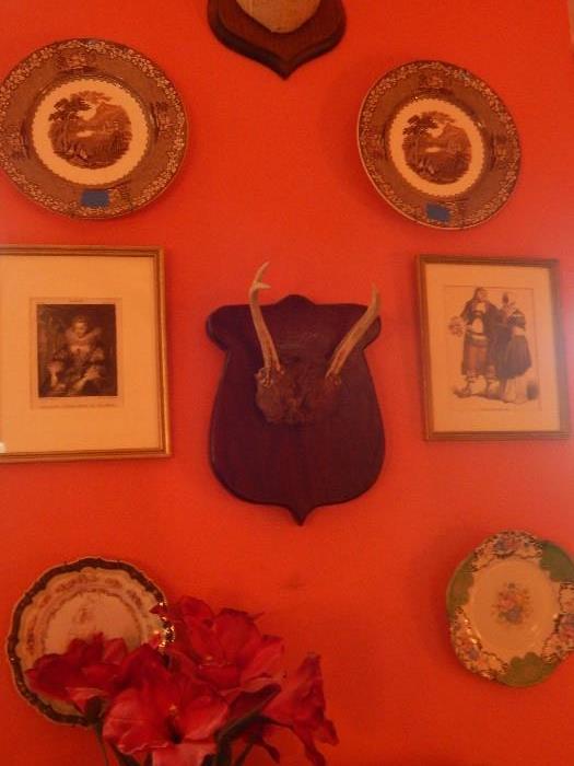 Antlers, antique plates and old lithographs, some hand colored.