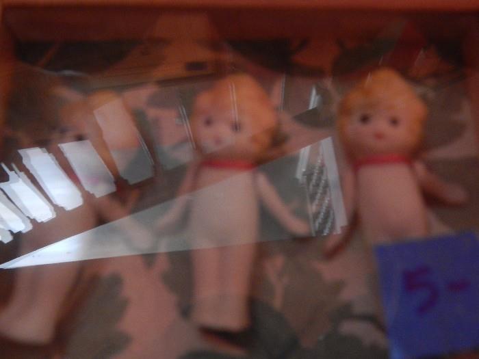 Boopy dolls showcased in a shadowbox .