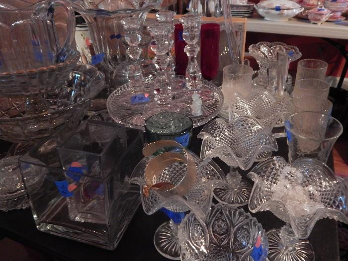 Lots of glassware, candle sticks, ice cream cups, vases and more...some glass, some crystal.
