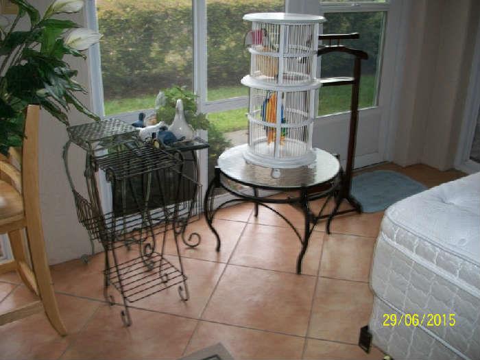 clthing butler, plant stands , wood bird cage, metal and glass top coffee table