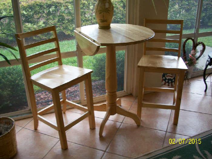 Wood cafe table with drop leaf sides and 2 chairs