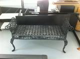 Old rolled-arm iron bench