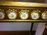 Porcelain medallion detail of console apron