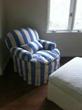 Upholstered chair and ottoman