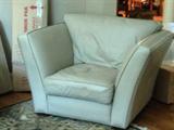 One of three pieces/taupe leather chair + two matching loveseats
