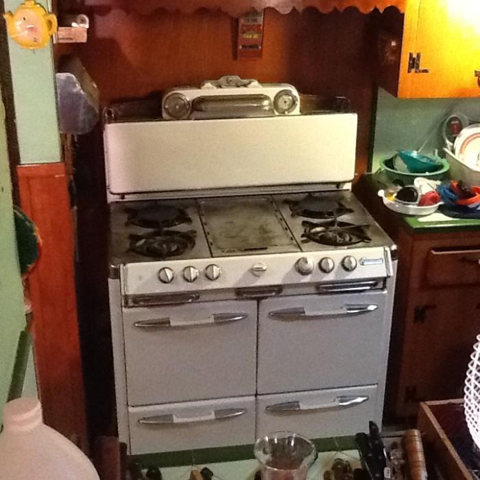1950's Okeefe & Merritt Gas Stove w/ Oven and Grillevator; 4 burners & Griddle; 2 clocks; light; salt & pepper shakers.  In really good shape! A few more pics @ www.tickledpinksales.com