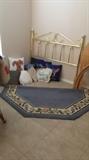 brass bedpost blue rug