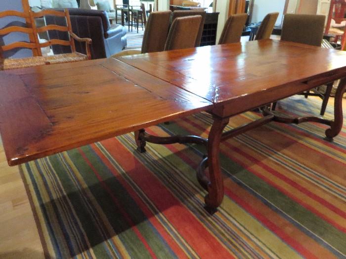HENREDON TRESTLE DINING TABLE
(DETAIL OF OPEN EXTENSION)
EXTENDS TO 132 INCHES  South American mahogany solids, cherry veneer.Avignon Finish 