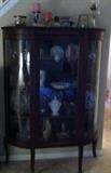 glass round front china cabinet (part of glass is cracked)