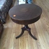 Table has hidden drawer. vintage