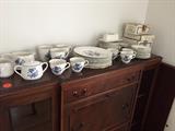 wedgewood china atop display cabinet/secretary
