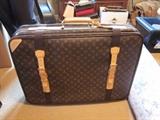 Authentic Louis Vuitton luggage.  Approx. dimensions:  27.56 x 19.29 x 8.27 inches.  Retail new: $2,350.00
