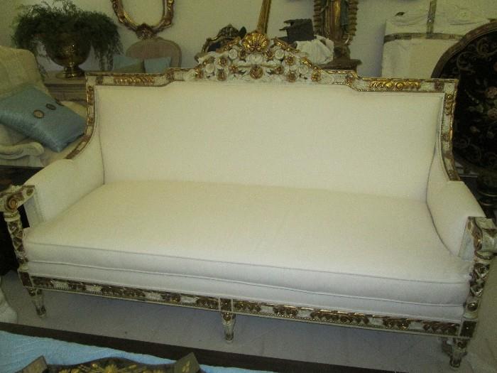 Fine European craftsmanship and design in this beautiful hand-gilded sofa