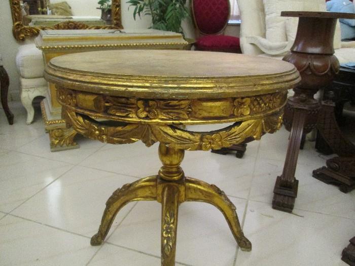 One of many beautiful gilded side tables