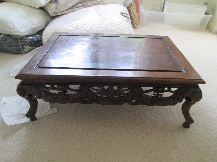 beautiful carvings adorn this antique prayer table