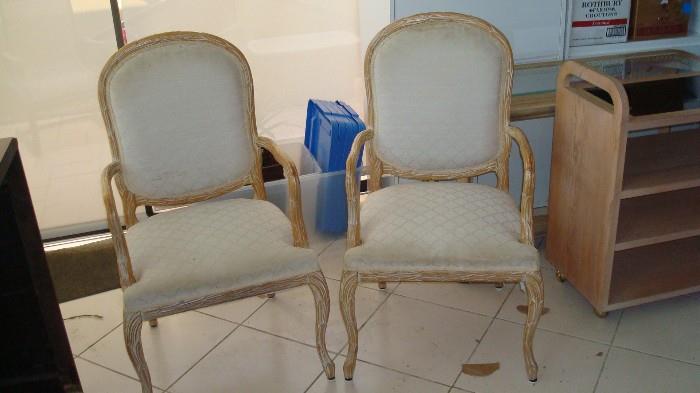 two light wood armchairs