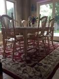 Kitchen table w/glass top and 6 chairs.  Carpet for sale too.