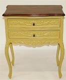 Mustard colored hand carved wood side table.