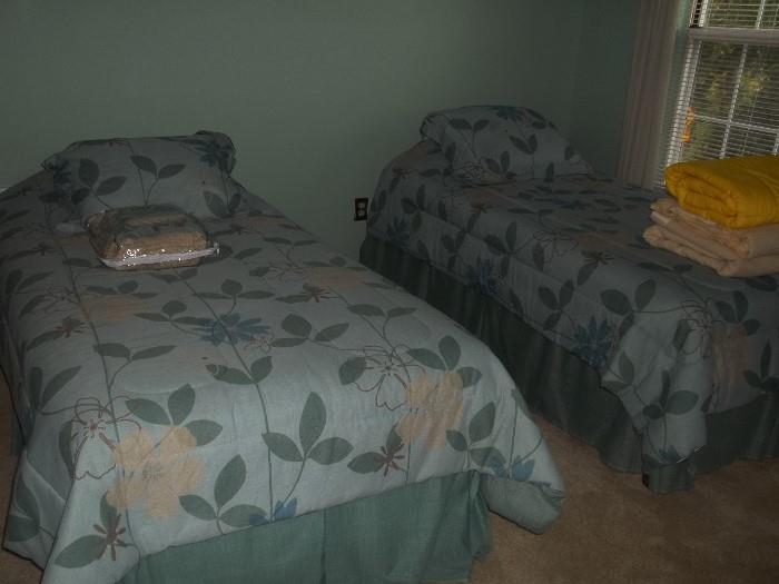 Two Twin Size Beds. Linens Sold Separately.