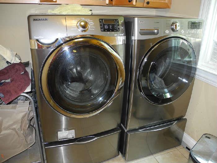 Almost NEW! Stainless washer and dryer plus the stands! Cost $1200 each.