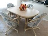 table w/ 6 rolling chairs ( only 4 pictured)