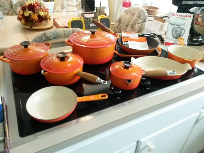 Orange red Le Creuset cookware