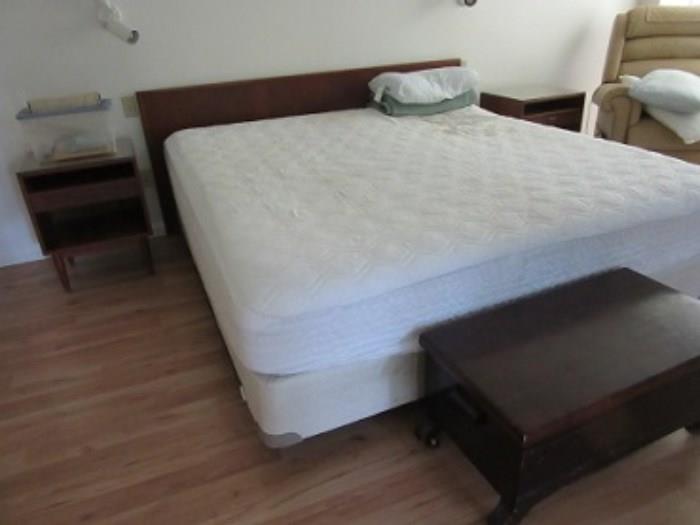 Queen bed with Serta perfect mattress.  Cedar chest at foot of the bed.  End tables on each side of bed.