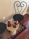 Metal bistro chairs, runner rug, marble table top