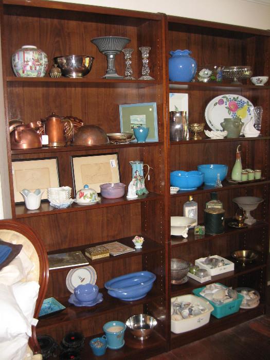 Got a little bit of everything here, copper molds, copper bowl, sea shells , more pottery flower pots, and much more. Nice pair of bookshelves. 
