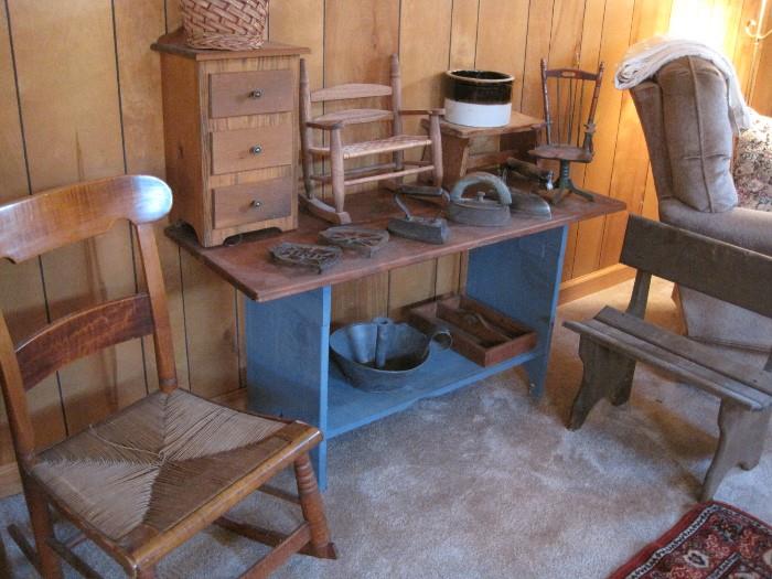 Country chair, irons, trivets and primitives.