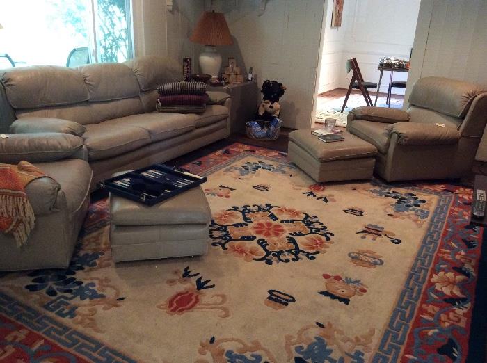 Family room leather furniture, colorful area rug