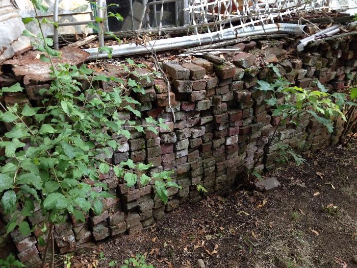 This pile of bricks needs a new home; tons of scrap wood and metal too