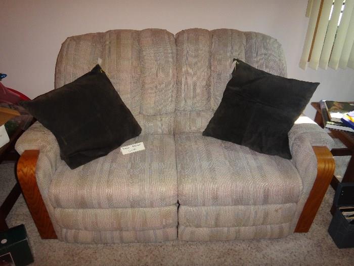 Double recliner loveseat in excellent condition.   Leather pillows. (In Christmas Room). 