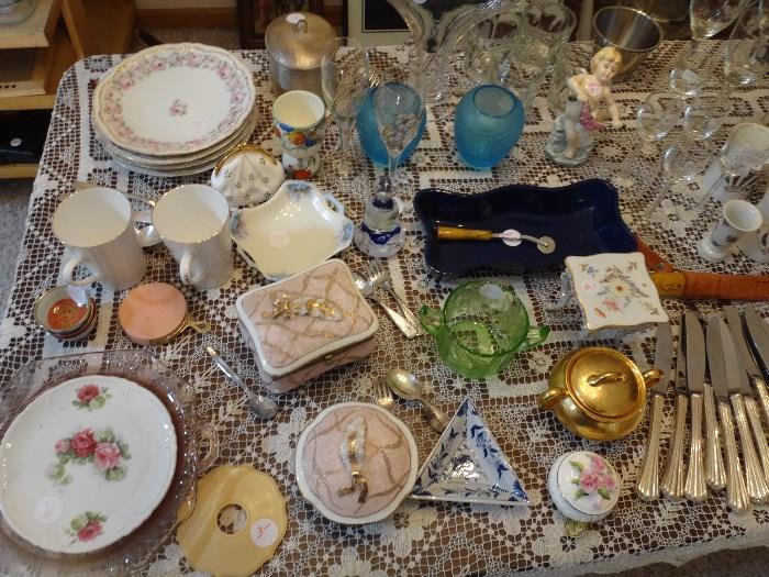 Table full of assorted nice pieces in dining room.  