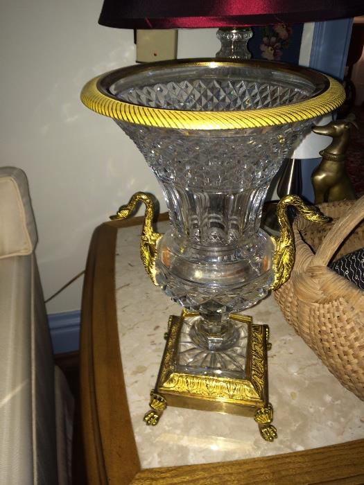 Vase, glass body with star cut square foot graduating to paneled nine stem; the lower portion diamond cut with two brass swan handles. Mounted on square bras base. 
