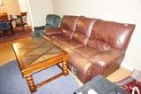 sofa with two recliners, recliner chair, coffee table with inlay tile, blue oval rug