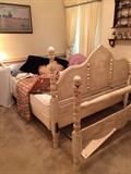 antique full bed frame painted; Sleep Number bed; shelf, which has a collection of miniature shoes