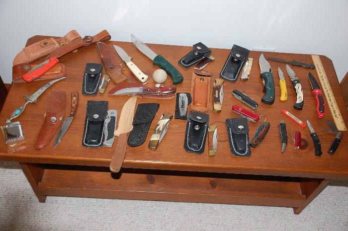 selection of pocket and sheath knives
