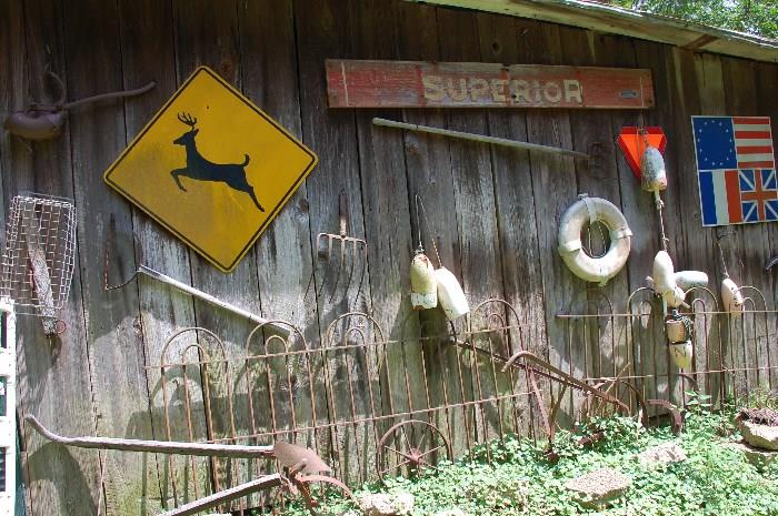 Large selection of Barn side décor items sign, farm implements more wrought iron fencing
